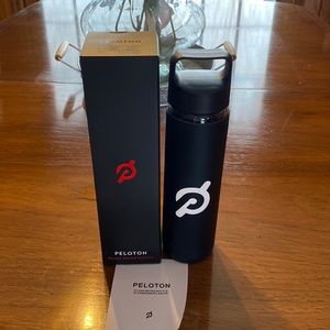 - Peloton glass water bottle. Black with white peloton